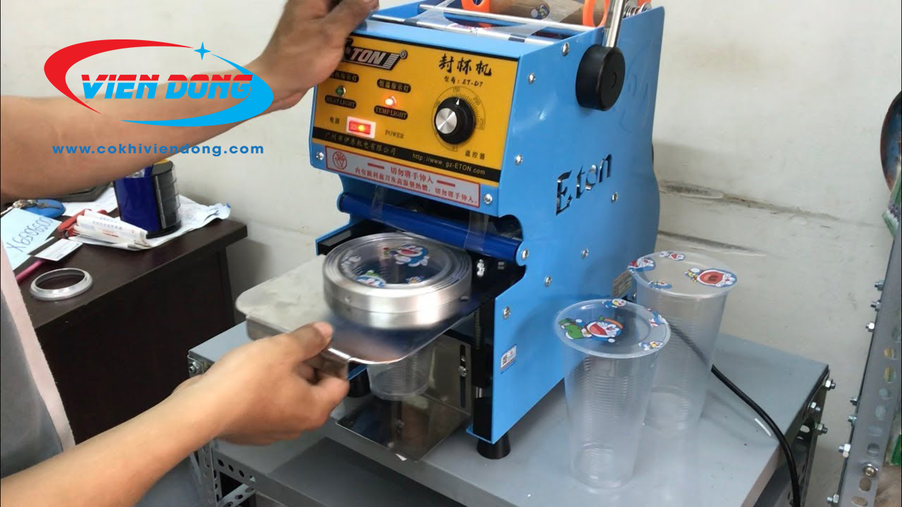 Máy dán miệng cốc